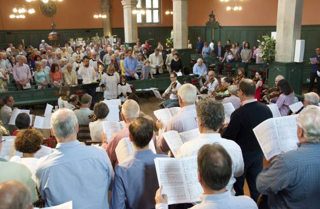 Musical performance, choir and musicians performing for audience in church